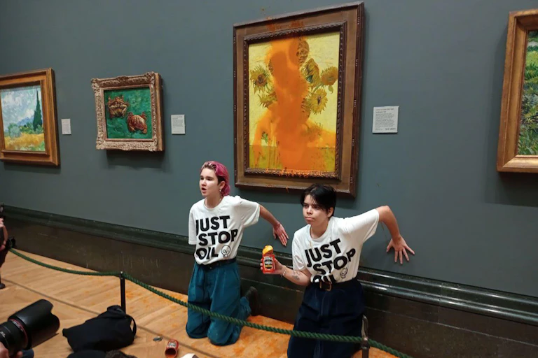 Two protesters in a gallery.