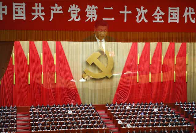 A multiple exposure photo shows Chinese President Xi Jinping during the opening ceremony of the 20th National Congress of the Communist Party of China at the Great Hall of People in Beijing, China, 16 October 2022.