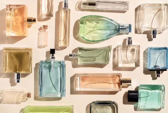 An assortment of different coloured perfume bottles.