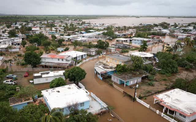 Flooded streets in a tropical city inundated with brown water