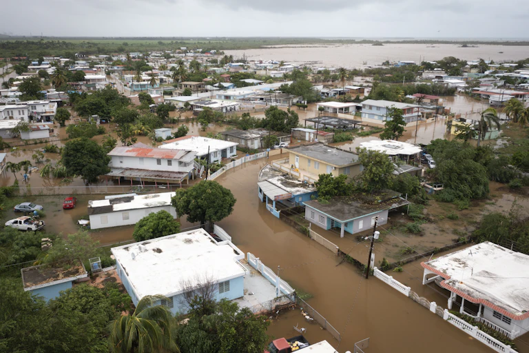 Flooded streets in a tropical city inundated with brown water