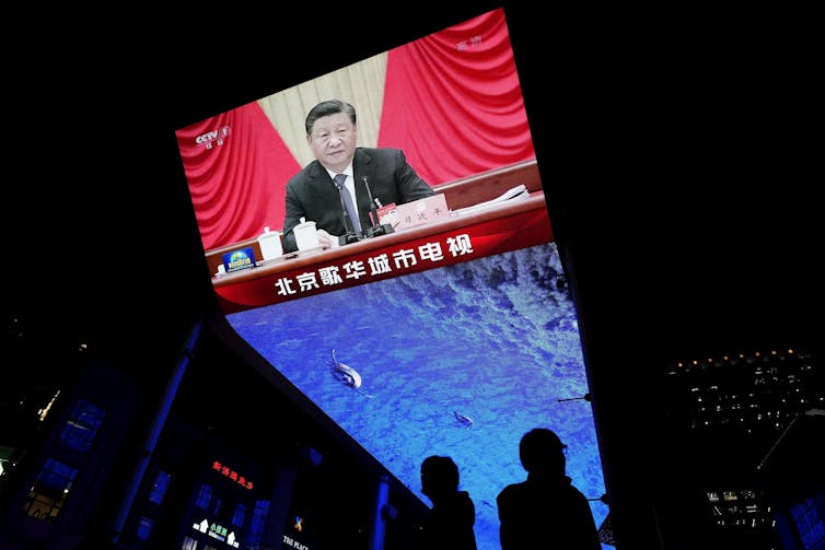 Xi Jinping shown on a monitor