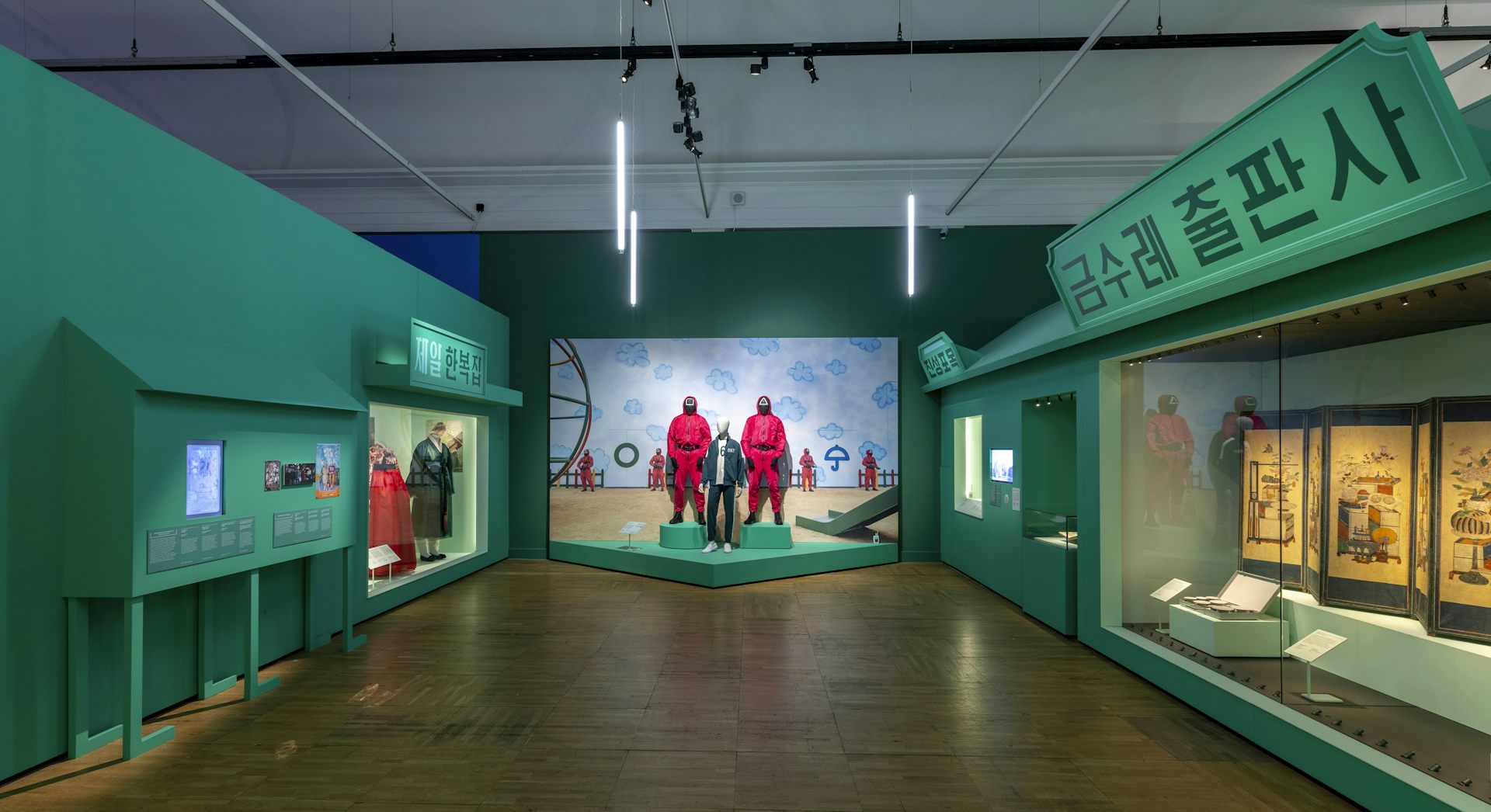 A gallery with exhibits of posters and costumes.