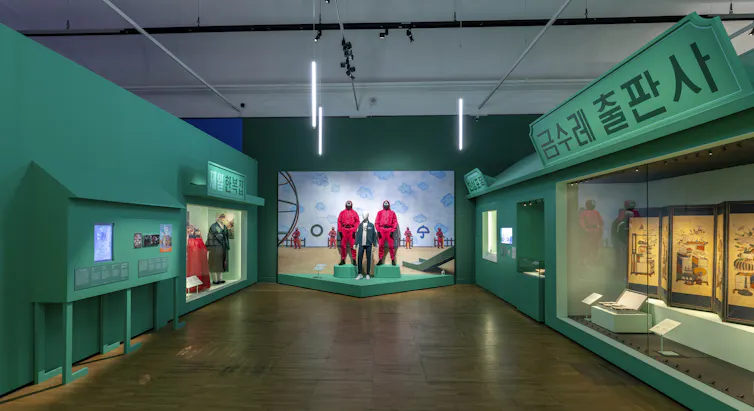 A gallery with exhibits of posters and costumes.
