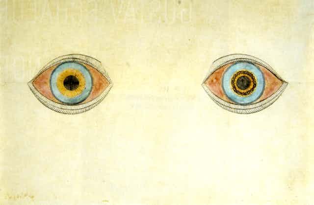Deux yeux dessinés aux crayons de couleurs et de couleurs différentes, 