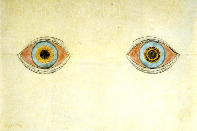 Deux yeux dessinés aux crayons de couleurs et de couleurs différentes,