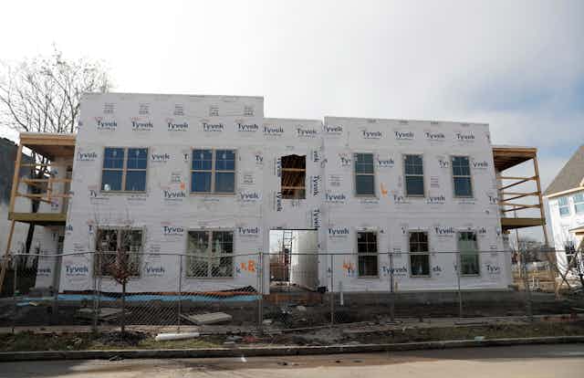 the facade of a housing development under construction