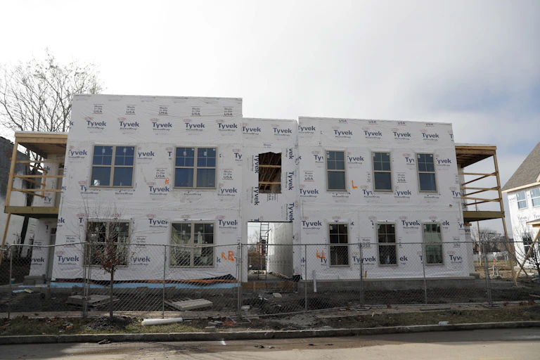 the facade of a housing development under construction