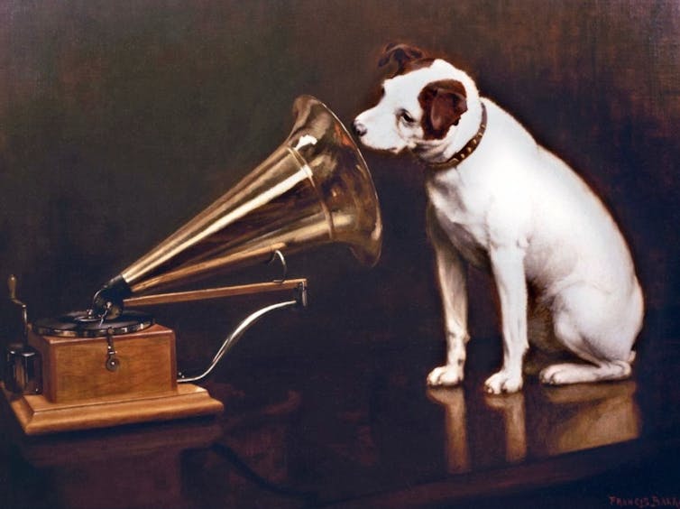 Painting of a black and white dog looking into the horn of a Victorian record player