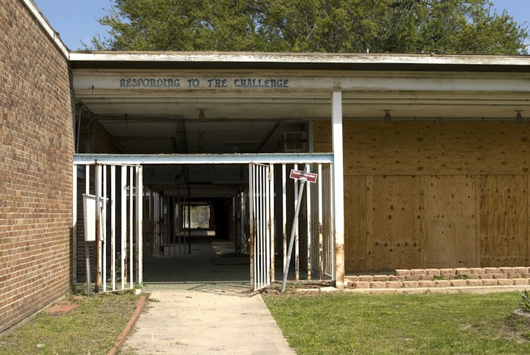 A frontal view of a boarded up school in New Orleans in the wake of Hurricane Katrina.
