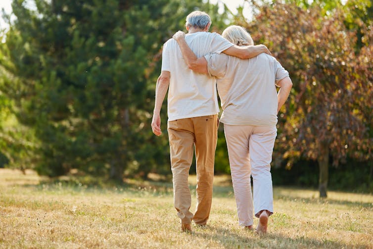 older couple walking away