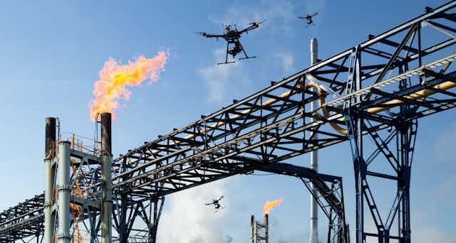 Drone attack concept. Pipeline with gas flare stacks. Concept: energy crisis, Russia Ukraine conflict, sanctions, EU, Europe, Nord Stream 2