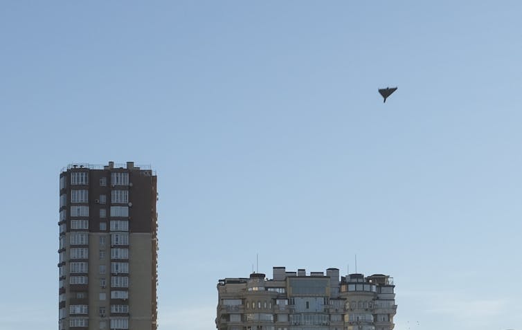 A drone photographed as it flies over the rooftops of Kyiv, Ukraine, October 2022.