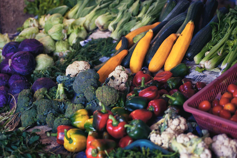 Fresh vegetables in a market stall.