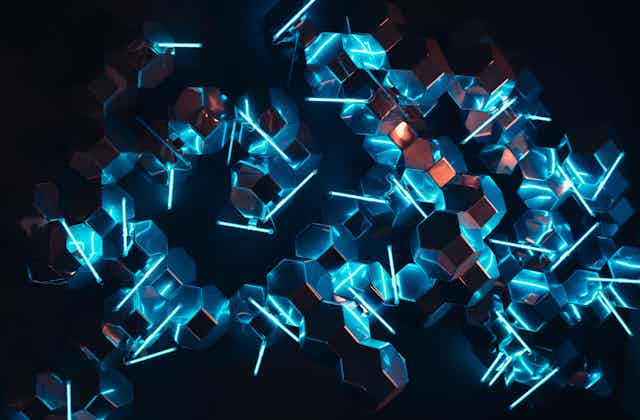 blue neon lights reflected in mirror cubes