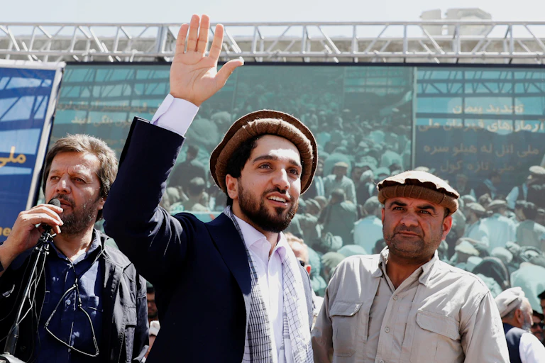 NRF leader Ahmda Massoud waves to supporters at a rally.