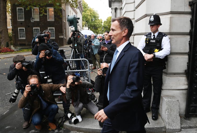 Side view of Jeremy Hunt speaking to press outside of Downing Street