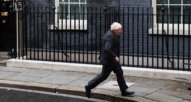 Boris Johnson running outside 10 Downing Street