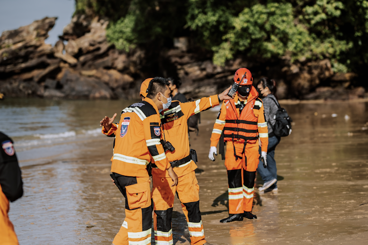 Search and rescue team in high vis on the beach