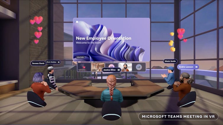 A virtual reality desk showing avatars sitting around a meeting table.