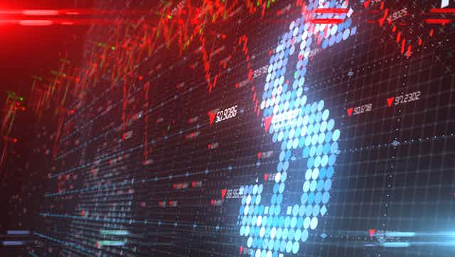 Digital screen showing large dollar sign and red graph lines.
