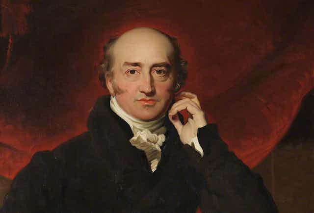 Painted portrait of George Canning, a balding man with sideburns, against a red background