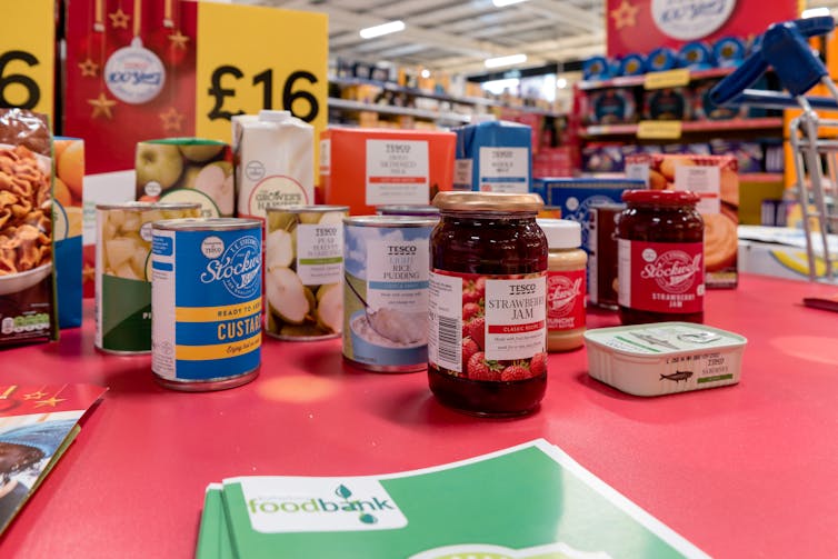 Food products on a red table.