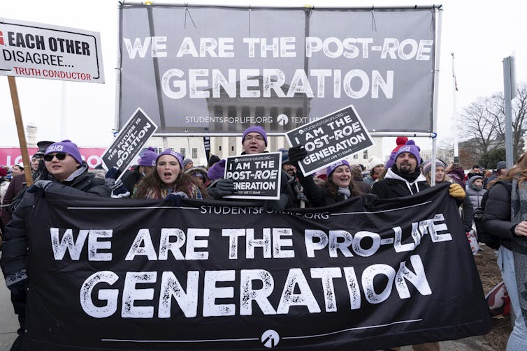 Anti-abortion activists march outside of the U.S. Supreme Court during the March for Life in Washington, Friday, Jan. 21, 2022.