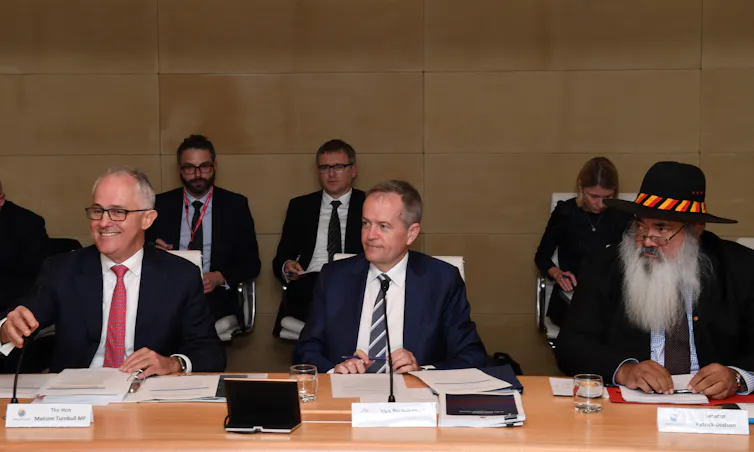 Prime Minister Malcolm Turnbull (left), Opposition Leader Bill Shorten and Senator Patrick Dobson listens to remarks at a meeting of the Indigenous Referendum Council