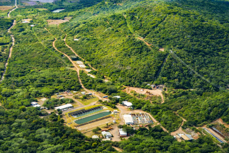 A mine surrounded by greenery