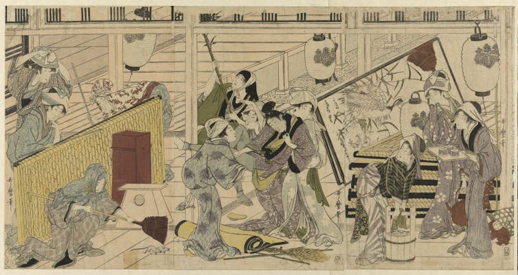 A painting on a scroll shows several people in traditional Japanese clothing intensely cleaning a house.