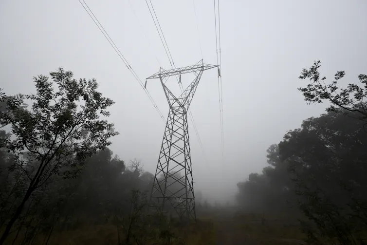 transmission tower in mist