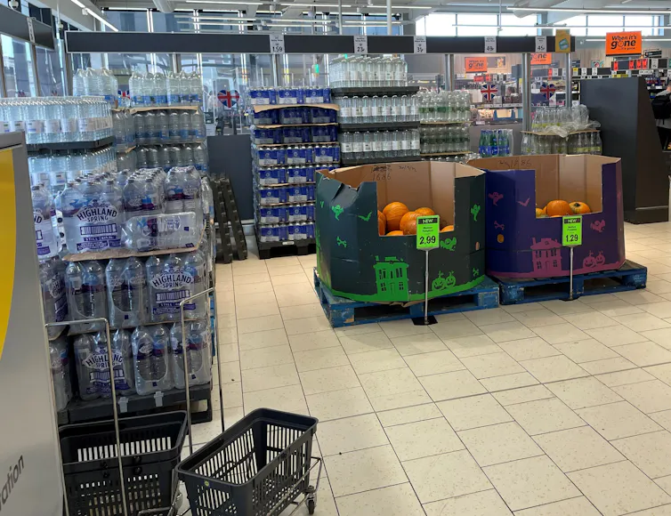 Water being sold at store entrance.