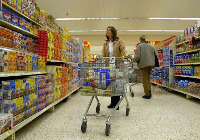 A woman shopping in a UK supermarket.