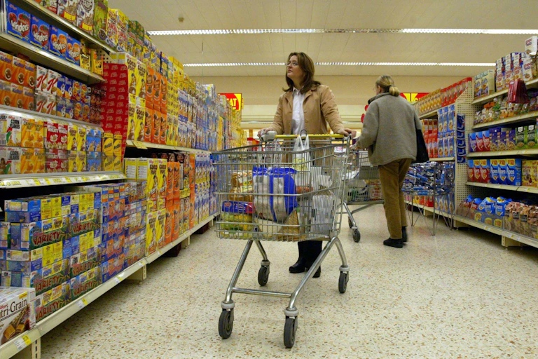 A woman shopping in a UK supermarket.