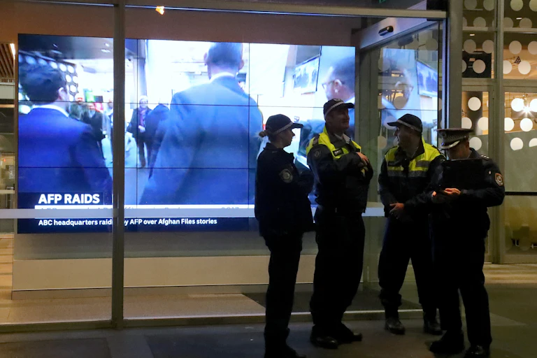 Police raid the ABC offices.