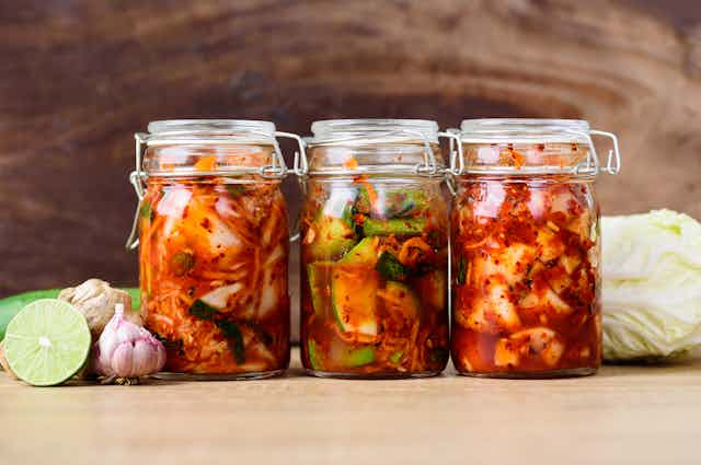 Three jars of kimchi.