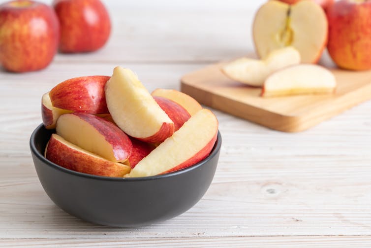 A bowl of slices apples.