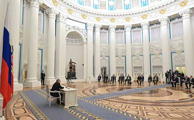 Russian President Vladimir Putin chairs a face-to-face meeting of the National Security Council to discuss the recognition of the Ukrainian regions of Donetsk and Lugansk at the Kremlin Grand Palace, February 21, 2022