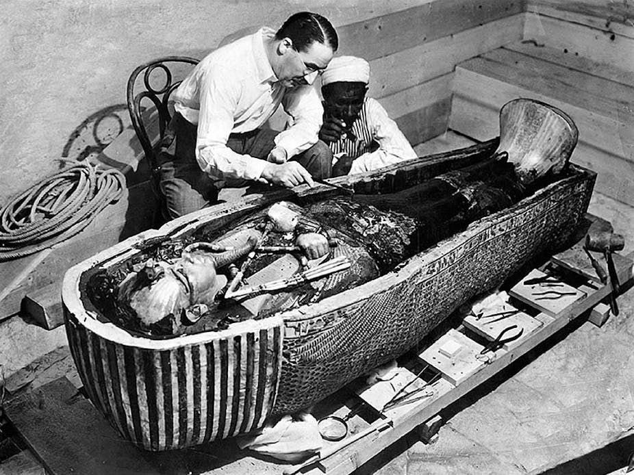 Howard Carter, Ahmed Gerigar and King Tutankhamun's sarcophagus, opened three years after the tomb was discovered, in 1925. 