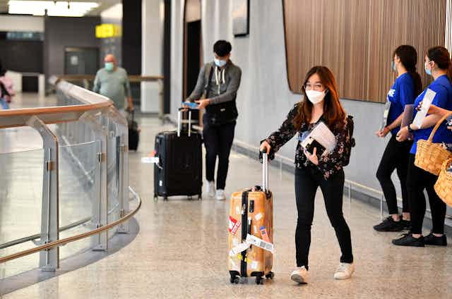 Passengers arriving at Melbourne airport from Singapore in November 2021.