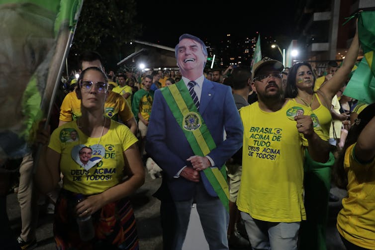 Supporters of Brazilian President and re-election candidate Jair Bolsonaro react to the results of the second round of presidential elections, in Rio de Janeiro, Brazil, 30 October 2022.