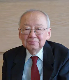 An elderly East Asian man wearing a suit.
