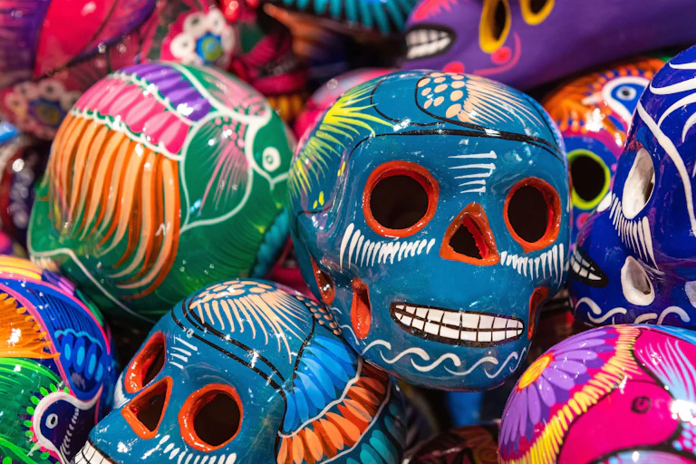 A pile of colourful Day of the Dead skulls.