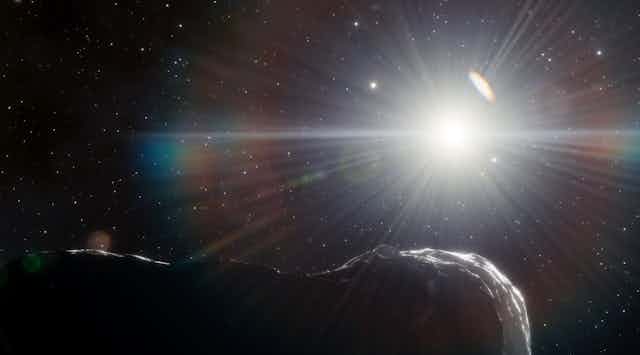Artist's impression of an asteroid, with the Sun in the background.