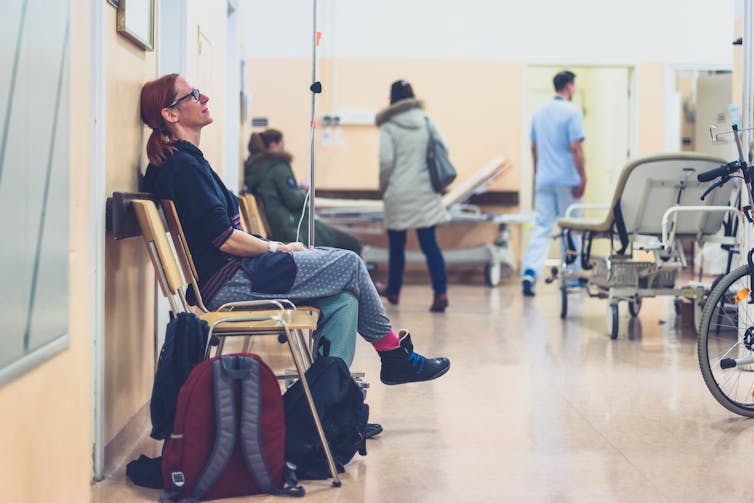 Woman waits in hospital waiting room