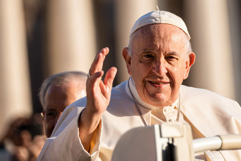 Close-up shot of a man waving.