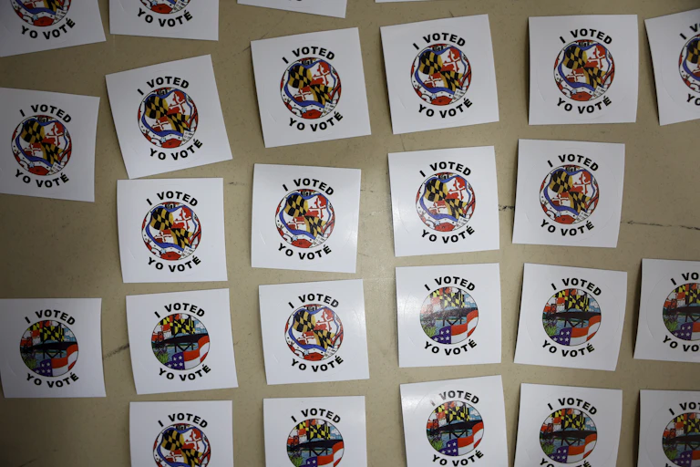 A grid of stickers with 'I voted/Yo vote' written on them.