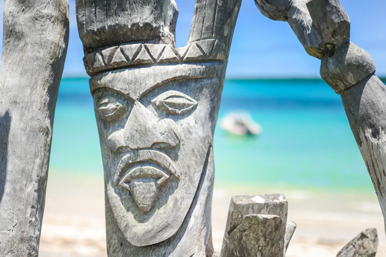 Wooden carving on beach