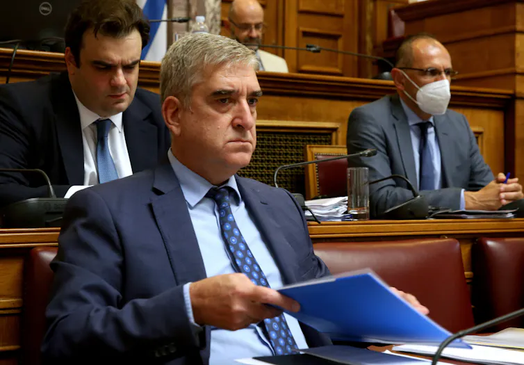 Panagiotis Kontoleon sitting at a desk.